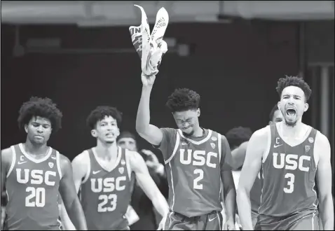  ?? Tribune News Service ?? Players from USC react during a game against Kansas in the second round of the NCAA tournament. The Trojans, along with UCLA, are both in the Sweet 16 this weekend.