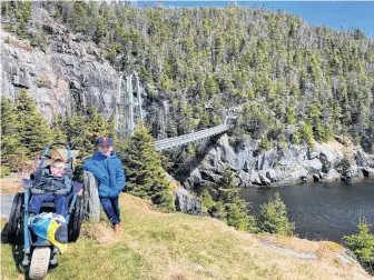  ?? CONTRIBUTE­D ?? Five-year-old brothers Lyndon and Zander were able to hike the La Manche trail with their mother, Adina Stamp, earlier this month thanks to a specialize­d wheechair, which the family borrowed from the Janeway children’s hospital for Lyndon.