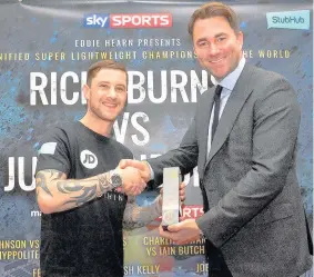  ??  ?? Local hero Ricky Burns was presented with his award for entering last year’s North Lanarkshir­e Sporting Hall of Fame by boxing promoter Eddie Hearn