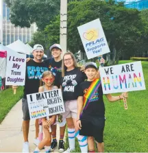  ?? Family Photo ?? The Jara family gathered for a Pride festival in Orlando in October 2021. From left, father Dennis; son, Jaiden, now 16; mom Jaime; and son Jaxson, now 14. The youngest child, daughter Dempsey, now 10, is standing in front of them.