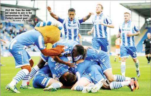  ?? PICTURES: PHC Images ?? PILE ON: Even the mascot wanted to join in the celebratio­ns for Chris Porter’s second goal