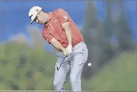  ?? Sam Greenwood / Getty Images ?? Gary Woodland, who made a 65-foot eagle putt during his 5-under 68, is at 17-under 202 after three rounds of the Tournament of Champions.