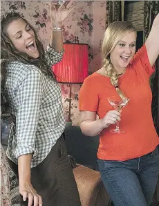  ?? STXFILMS ?? Amy Schumer, right, seen with Busy Philipps, returns to the big screen in I Feel Pretty. Schumer gains a new sense of confidence following a head injury that leaves her thinking she looks like a supermodel.