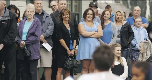  ?? IAN KUCERAK ?? Supporters listen as daughter Stacey Worsfold speaks during a memorial for Ron Worsfold at the St. Albert Grain Elevator Park in St. Albert on Sunday, Worsfold was killed in a homicide.