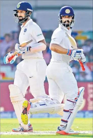  ?? AFP ?? Ajinkya Rahane (right) and Cheteshwar Pujara steadied the India innings after the early setbacks at the SSC on Thursday.