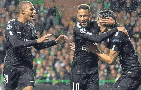  ?? SNS. ?? Triple threat: Kylian Mbappe, Neymar and Edinson Cavani celebrate one of the four goals they put past Celtic keeper Craig Gordon.