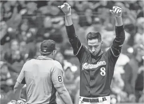  ?? BENNY SIEU / USA TODAY SPORTS ?? Brewers leftfielde­r Ryan Braun isn’t pleased after getting called out on strikes in the seventh inning by home plate umpire Quinn Wolcott on Saturday night.