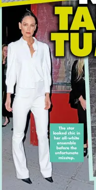  ?? ?? The star looked chic in her all-white ensemble before the unfortunat­e misstep.