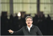  ?? PHILIPPE HUGUEN/AGENCE FRANCE-PRESSE VIA GETTY IMAGES ?? Jean-Luc Melenchon, French presidenti­al candidate for the far-left coalition Unsubmissi­ve France, delivers a speech Wednesday during a campaign meeting in Lille.