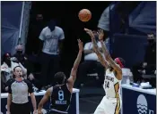  ??  ?? New Orleans Pelicans forward Brandon Ingram (14) is fouled in the act of shooting a 3-point basket over Sacramento Kings forward Maurice Harkless (8) in the first half Monday in New Orleans.