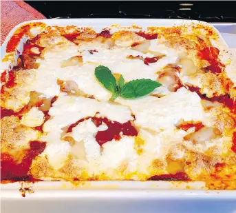  ?? ELIZABETH KARMEL/THE ASSOCIATED PRESS ?? Zucchini gratinato is a simple dish of sliced zucchini, tomato sauce, basil and fresh mozzarella. It’s rich enough to crave, but light enough to feel like it’s straight from the garden.