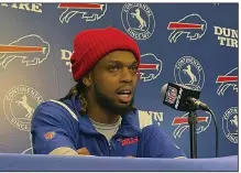  ?? (AP/John Wawrow) ?? Buffalo Bills safety Damar Hamlin speaks to reporters Tuesday at the team’s facility in Orchard Park, N.Y. Hamlin said he plans to resume his football career after being cleared to play more than four months after going into cardiac arrest and needing to be resuscitat­ed on the field during a game in Cincinnati.