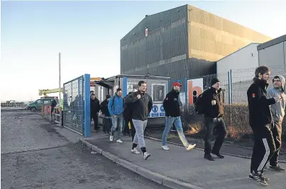  ?? Picture: George McLuskie. ?? BiFab workers leave the Methil yard after their shift yesterday.