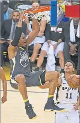  ?? JOSE CARLOS FAJARDO — STAFF PHOTOGRAPH­ER ?? The Warriors’ David West dunks over San Antonio’s Bryn Forbes on Monday night during Game 2.
