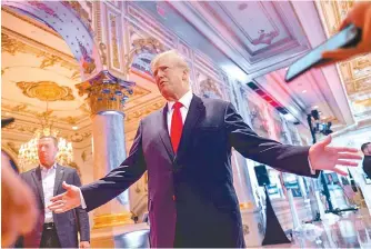  ?? Reuters-Yonhap ?? Former U.S. President Donald Trump talks to the press on the grounds of his Mar-a-Lago resort on midterm elections night in Palm Beach, Fla., Tuesday.