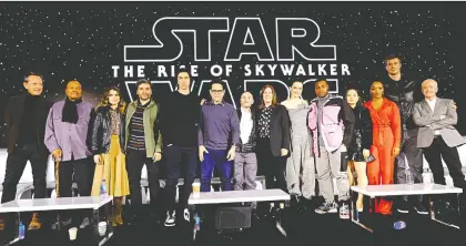  ?? ALBERTO E. RODRIGUEZ/GETTY IMAGES FOR DISNEY ?? The gang’s all here: Richard E. Grant, left, Billy Dee Williams, Keri Russell, Oscar Isaac, Adam Driver, director J.J. Abrams, writer Chris Terrio, producer Kathleen Kennedy, Daisy Ridley, John Boyega, Kelly Marie Tran, Naomi Ackie, Joonas Suotamo and Anthony Daniels attended the recent news conference for Star Wars: The Rise of Skywalker, the final chapter in a 42-year saga.