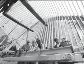  ?? Mary Altaffer Associated Press ?? THE CONSTRUCTI­ON industry added 45,000 jobs in December, possibly benefiting from warmer temperatur­es. Above, workers on a project in New York City.