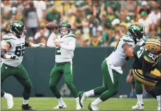  ?? Quinn Harris / Getty Images ?? Jets quarterbac­k Zach Wilson passes during the first half against the Packers on Saturday in Green Bay, Wis.