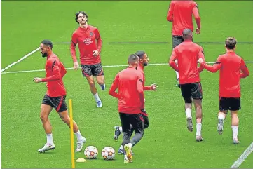  ?? AFP ?? Atletico Madrid’s Joao Felix (2L) attends a training session on the eve of their Champions League match against Manchester City.