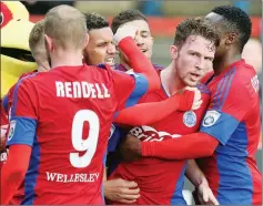  ?? PICTURE: Ian Morsman ?? SAVIOUR: Aldershot Town’s Jim Kellermann is congratula­ted for his injury-time equaliser