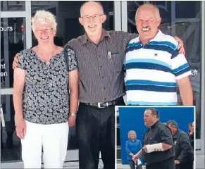  ??  ?? Holding strong: Doctor Ian Kirkby, centre, will still be seeing his longstandi­ng patients such as Lewis and Denise France despite the big move.