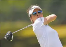  ?? Drew Hallowell / Getty Images ?? Gaby Lopez plays her shot from the fifth tee Friday in Rogers, Ark., near where she played collegiate­ly at Arkansas.