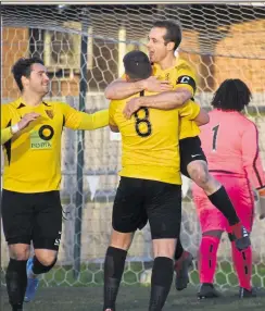  ?? Picture: Jenny Verrillo ?? Kennington’s Gary Clarke celebrates his second goal against Meridian with team-mate Reiss Crimmen