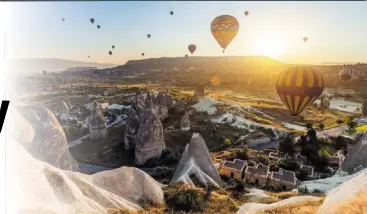  ?? ?? Cappadocia is a wonderland filled with hot air balloons, whimsical fairy chimneys and spectacula­r rock formations painted with stunning natural-coloured hues.
