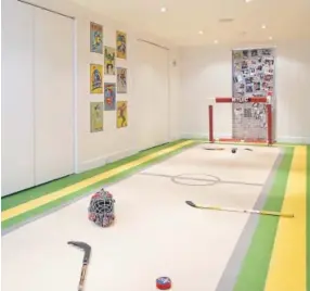  ?? Courtesy of Alex Kotlik ?? Melanie Morris, an interior designer in Brookville, N.Y., turned her basement into an indoor hockey rink for her three sons.