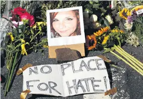  ?? Picture / AP ?? Mourners have been leaving flowers at a makeshift memorial for Heather Heyer in Charlottes­ville.