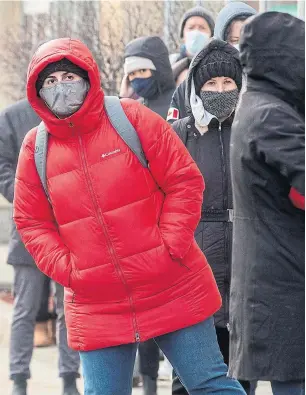  ?? CHRIS YOUNG THE CANADIAN PRESS FILE PHOTO ?? People stand in line for walk-in PCR tests in Toronto in December. Tens of thousands of people in Ontario are still waiting for their test results.