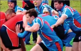  ??  ?? FIT: Rory, centre, playing rugby. The game could have caused his sight loss