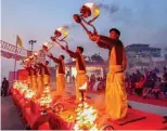  ??  ?? From top: During Dev Deepawali, the ghats sparkle in the light of a million lamps; the Ganga Aarti ritual is performed daily at dusk.