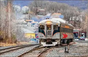  ?? Tim Doherty ?? A rail diesel car leaves the station track in North Adams, Mass. Easter Bunny Hop Trains departing from Adams will run from March 25-April 2.
