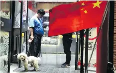  ?? AP PHOTO/NG HAN GUAN/FILE ?? A city in southweste­rn China has banned daytime dog walking and banished the pets from many public spaces.