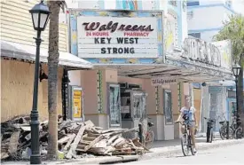  ?? WILFREDO LEE/AP ?? Piles of debris still remain in Key West, but the city’s many tourist attraction­s are making progress. Key West officials expect the city to be ready for Fantasy Fest on Oct. 20.