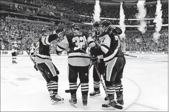  ?? [GENE J.PUSKAR/THE ASSOCIATED PRESS] ?? The Penguins’ Matt Cullen, right, celebrates with, from left, Carl Hagelin, Mark Streit and Ian Cole after scoring during the second period.