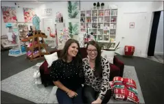  ?? REBECCA BLACKWELL — THE ASSOCIATED PRESS ?? Prep Obsessed business co-owners Corey O’Loughlin, left, and Nina Vitalino at their retail store in Palm Beach Gardens, Fla. Black Friday sales at their online boutique and brick-and-mortar location jumped more than 30% over last year, a relief for the owners.