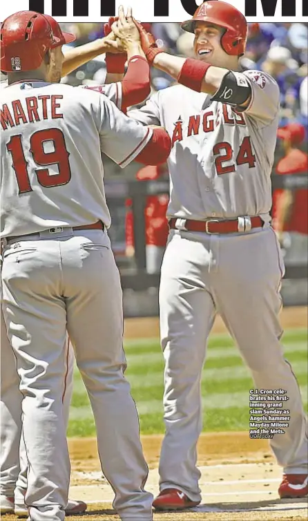  ??  ?? C.J. Cron celebrates his firstinnin­g grand slam Sunday as Angels hammer Mayday Milone and the Mets.