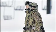  ?? Picture: KYODO/ REUTERS ?? ON A MISSION: Japan’s Self Defence Forces undertake rescue work at a ski resort near Kusatsu Shirane