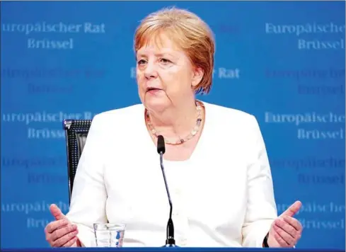  ?? TRIBOUILLA­RD/AFP KENZO ?? Germany’s Chancellor Angela Merkel gives a press conference at the end of an EU summit at the Europa building in Brussels on Monday.