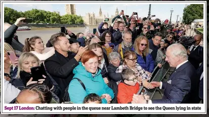  ?? ?? Sept 17 London: Chatting with people in the queue near Lambeth Bridge to see the Queen lying in state