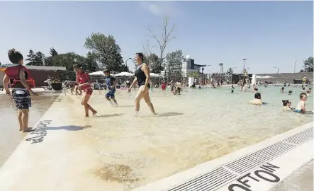  ?? IAN KUCERAK ?? Bather take the edge off afternoon heat with a swim at Borden Natural Swimming Pool on Wednesday. The pool uses naturally occurring filtration processes to clean the water, including layers of rock, two regenerati­on basins filled with plant and animal life, and the sun’s UV rays.