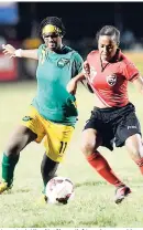  ?? FILE ?? Jamaica’s Khadija Shaw (left) makes a tackle on Trinidad and Tobago’s MacKenzie Marsh in the Caribbean Football Union Women’s Under -20 final at the Anthony Spauldings Sports Complex in 2013. Shaw scored in Jamaica’s 2-1 loss to Venezuela at the CAC Games in Colombia yesterday.