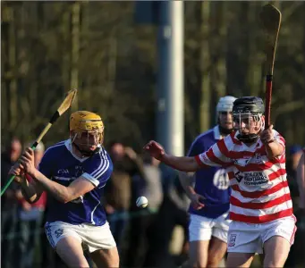  ??  ?? Damien Reck of Oylegate-Glenbrien about to clear as Niall Murphy (Ferns) attempts the block.