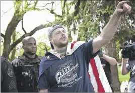  ?? JOHN RuDOff vIA AP ?? In an April 29 photo provided by John Rudoff, Jeremy Joseph Christian (right) is seen during a Patriot Prayer organized by a pro-Trump group in Portland, Ore.