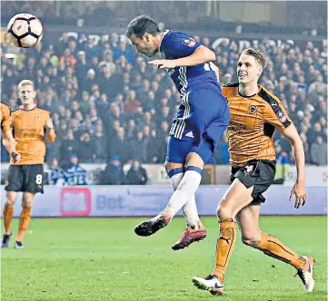  ??  ?? Deadlock broken: Pedro gives Chelsea the lead at Molineux last night with this second-half header