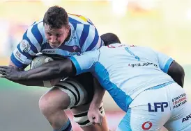 ?? /Ashley Vlotman/Gallo Images ?? Overcoming hurdles: JD Schickerli­ng is tackled by Trevor Nyakane of the Blue Bulls in the Currie Cup semifinal. Schickerli­ng, who suffered a broken neck four years ago, could make his Bok debut against England at the weekend.