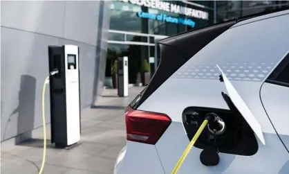  ?? Photograph: Jens Schlueter/AFP/Getty Images ?? ‘If you want to achieve net zero by 2050 you need to have 100% of vehicle sales electric by 2035.’ The Electric Vehicle Council and a group that includes car manufactur­ers has condemned Victoria’s proposed EV tax.