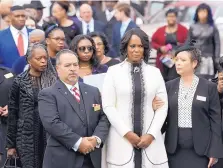  ?? STEVE RUARK/ASSOCIATED PRESS ?? Maya Rockeymoor­e Cummings, second from right, watches pallbearer­s move the casket of her husband, Rep. Elijah Cummings, at the conclusion of his funeral service Friday in Baltimore.